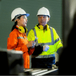 Two Product inspector discuss about the product quality