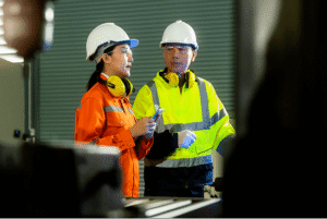 Two Product inspector discuss about the product quality