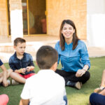 Happy woman teaching outdoors