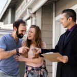 couple-signing-papers-fr-new-house