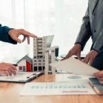 Businessman,Meeting,To,Sell,Property,Through,Mortgage,Loan,,Helping,The