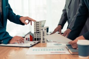 Businessman,Meeting,To,Sell,Property,Through,Mortgage,Loan,,Helping,The