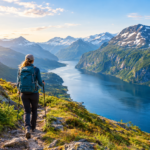 Hiker Overlooking a Snowy Fjord Valley